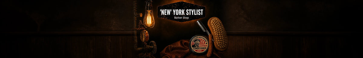 Ultrawide New York Stylist barber shop hero with NYS sign, Edison lamp, brush, razor and leather conditioner fully visible